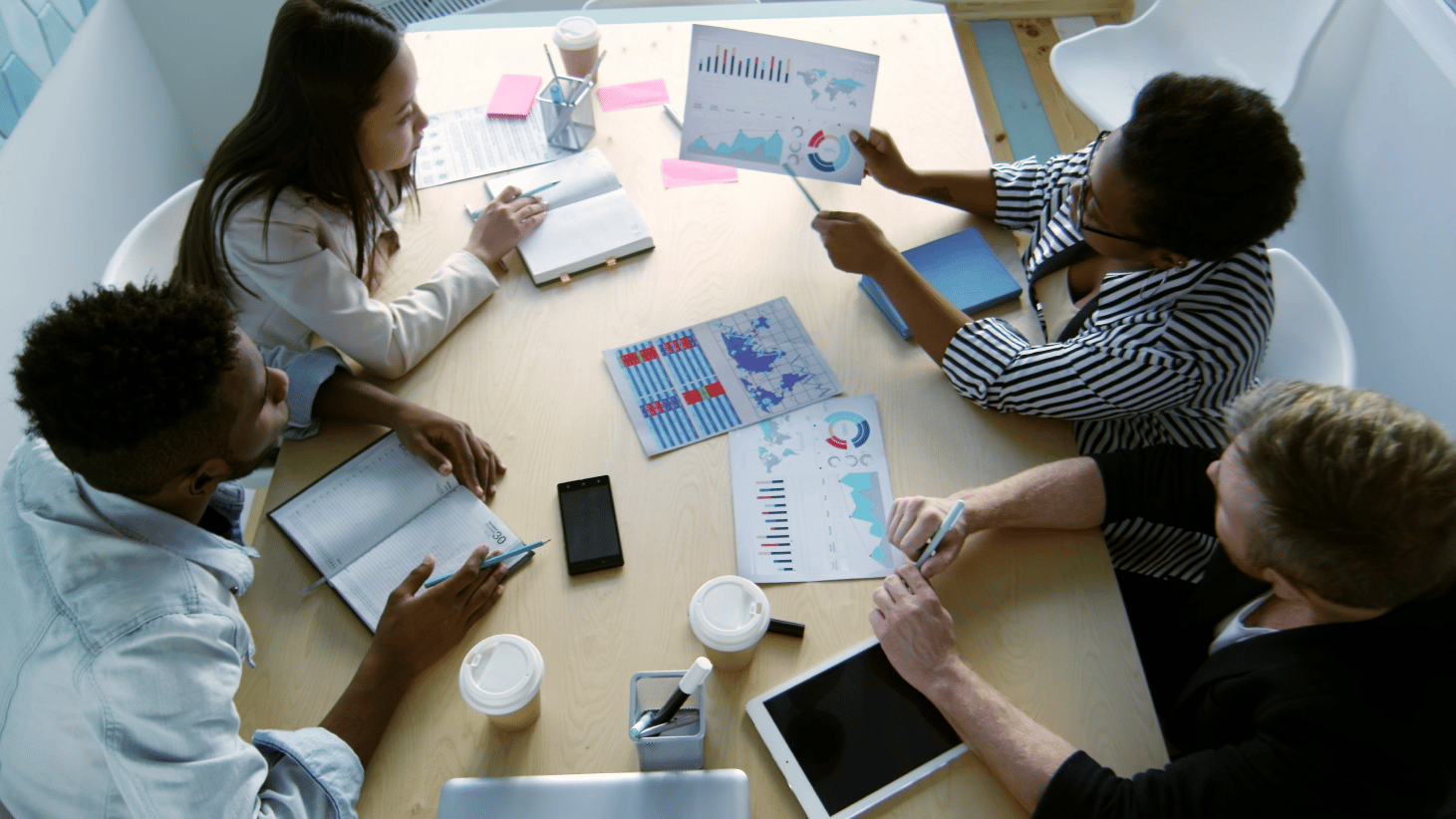 Founders collaborating around a strategy table