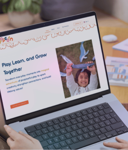 Pop Corn website displayed on a laptop
